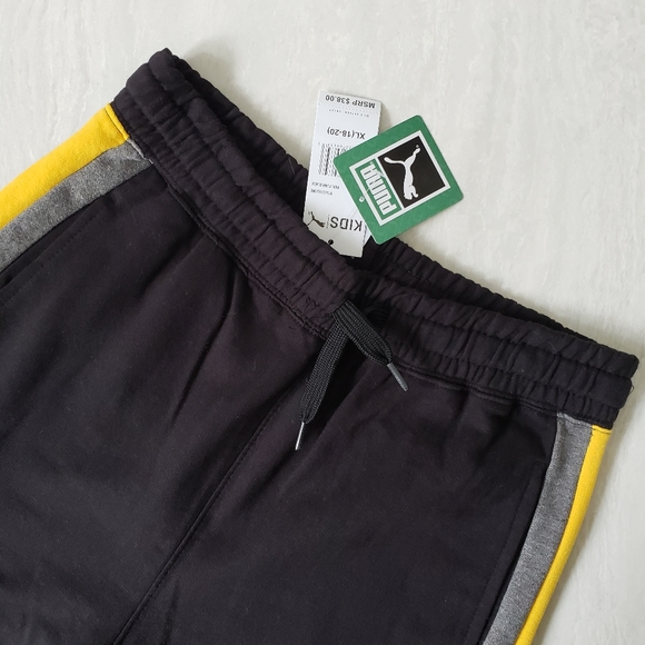 Brand new Puma sweatpants for kid's or women. Black with yellow and gray stripes - Picture 1 of 5